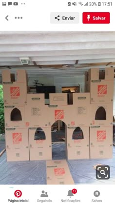 several boxes stacked on top of each other in front of a white awning with red lettering