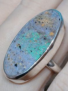 One of a kind, handcrafted, Louisiana Opal and sterling silver ring, Size  10(one free sizing). Top measures about 38mm X 19mm. Silver Handmade Opal Ring Collectible, Unique Handmade Silver Opal Ring, Unique Silver Opal Ring With Natural Inclusions, Handmade Unique Silver Opal Ring, Sterling Silver Opal Ring With Natural Inclusions, Silver Opal Ring With Natural Inclusions In Sterling Silver, Handmade Iridescent Sterling Silver Ring, Handcrafted Rings, Ring Jewelry