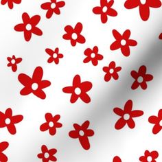 a white and red background with flowers on it