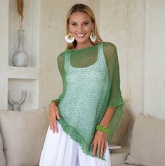 Comfortable and trendy. This poncho top is a practical essential for any wardrobe. Easy to pull on and easy to pair with so many different looks. The ruffled hem adds a feminine flair. Lightweight and very soft. Delicate material Lightweight and easy to travel with 100% soft rayon Use as a scarf Hand wash cold water, lay flat to dry One Size Casual Poncho For Spring, Casual One-size Poncho For Layering, Oversized Summer Poncho For Layering, Oversized Poncho For Summer Layering, Casual Free Size Top With Batwing Sleeves, Casual Free Size Batwing Sleeve Tops, Casual Batwing Sleeve Poncho For Spring, Versatile One-size Tops For Spring, Versatile One Size Tops For Spring