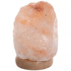 a large himalayan rock on a wooden stand with a white background and light brown wood base