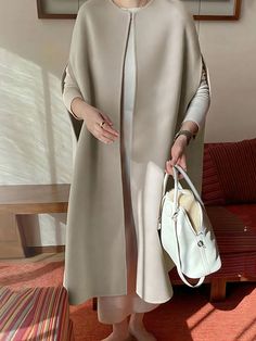 Simple Sleeveless Solid Color Round-Neck Cape Outerwear CREAMY WHITE-One_size How To Have Style, Cape Designs, Elegante Y Chic, Vest Coat, Vest Shirt, Japan Fashion, Modest Fashion, Vintage Looks, Clothing Items