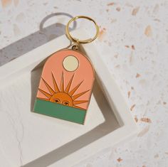 Keychains | Setting Sun Keychain | Loomshine Keychain Ideas For Him, Keychain Aesthetic Ideas, Sun Keychain, Fruit Keychain, Luxury Keychain, Product Photo Ideas, Keychain Aesthetic, Enamel Keychain, Boho Keychain