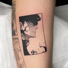 a woman's leg with a black and white photo on the side of it