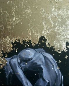 an abstract painting of a blue object floating in the water with gold flecks on it