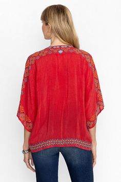 Intricately embellished with ornate placement embroidery, the Brony Blouse offers a unique boxy silhouette. Featuring a split neckline bordered with bold color and button front, this vibrant blouse is finished with relaxed Dolman sleeves for a light airy look. Pair with high waisted linen pants and leather sandals for a resort-ready look. Johnny Was Women's Brony Blouse in Equestrian Red, Size Medium, Linen/Leather Traditional Embellished Tops For Festival, Traditional Embellished V-neck Tops, Festive Tops With Geometric Embroidery, Red Bohemian Tops For Festive Occasions, Red Bohemian Top For Festive Occasions, Red Summer Tops With Embroidered Border, Traditional Embellished Red Tops, Traditional Red Embellished Tops, Bohemian Red Blouse With Intricate Embroidery