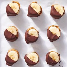 chocolate covered bananas and peanut butter on a baking sheet