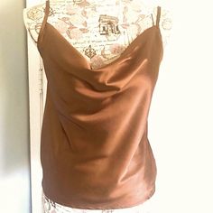 Nwt. Very Similar To The $90 Tank By Ekouaer. This Tank Top Is A Bronze-Brown Color In A Satiny Smooth Luxe Fabric That Looks Like Silk. It Has A Fluid Cowl Neckline And Adjustable Spaghetti Straps. Unlined. 100% Polyester. No Stretch. Should Be Hand Washed. Measures Approximately: 17” Across Armpits 21-22”Long From Mid-Strap 12.5” Long From Armpit Side 18” Wide At Base Brown Fitted Cami Tank Top, Elegant Brown Camisole, Chic Fitted Brown Camisole, Sleeveless Brown Tops For Night Out, Brown Sleeveless Top For Night Out, Chic Brown Sleeveless Camisole, Elegant Brown Sleeveless Camisole, Chic Brown Cami Top, Elegant Sleeveless Brown Tops