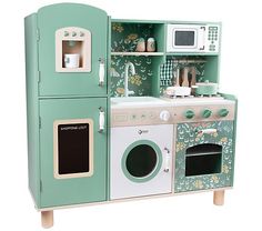 a green and white wooden play kitchen set