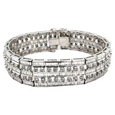 Experience the pinnacle of luxury with our 17.2 carat natural diamond link bracelet. Crafted from 18k white gold, it features 375 baguette and 100 round cut diamonds arranged in a five-row design. Unisex and weighing 68 grams with a width of 17.6mm, it offers excellent wrist coverage. This timeless statement piece is perfect for any formal occasion. Details: - Metal: 18k White Gold - Weight: 68 grams - Width: 17.6mm - Thickness: 4.1mm - Length: 7.5 inches Diamond Details: - Baguette Cut Diamonds Baguette Cut Diamond, Baguette Cut, 2 Carat, Round Cut Diamond, Formal Occasion, Link Bracelets, Round Cut, Diamond Bracelet, Natural Diamonds