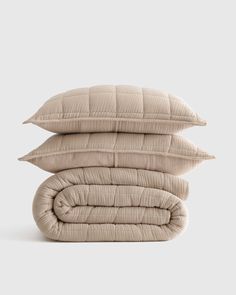 three pillows stacked on top of each other