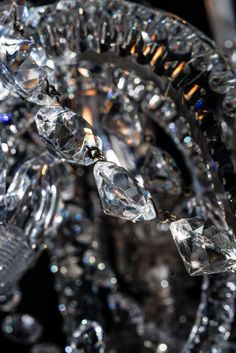 a crystal chandelier with lots of crystals hanging from it's centerpiece