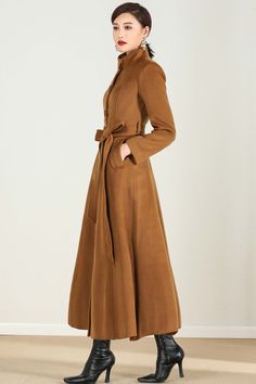 "This brown wool coat gives you the fall winter feels! Everything you need in a perfect midi wool coat is here. The wool coat to wear this season to work events, and out and about town....and now the search is over! It has been meticulously tailored with superior wool fabric that will keep you warm all season long. Every woman needs a wool coat in her wardrobe! DETAIL * Perfect Match with your favorite leggings, black slacks, denim jeans, etc * 50% wool blend, 50% fiber,nylon * Fully satiny lini Long Solid Wool Coat For Fall, Solid Color Long Wool Coat For Fall, Brown Single-breasted Wool Coat For Winter, Long Brown Wool Outerwear, Brown Long Sleeve Wool Coat For Fall, Elegant Brown Wool Coat With Long Sleeves, Elegant Brown Sweater Coat For Fall, Chic Brown Long Sweater Coat, Elegant Long Brown Sweater Coat