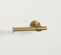 an old fashioned brass toilet paper roll holder