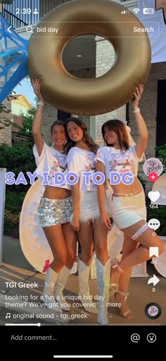 the girls are holding up a giant donut in front of their heads and body