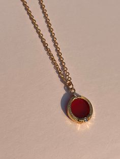 This striking red carnelian disc pendant necklace, radiates warmth and vitality with its vibrant hue. Suspended on a 24-inch delicate cuban chain, this piece not only enhances your style but also harnesses the healing properties of carnelian. Known for its ability to boost energy, creativity, and motivation, carnelian is believed to stimulate courage and passion while dispelling negative emotions. This piece is for inspiring confidence and vitality in your daily life. Red Carnelian, Carnelian Necklace, Red Necklace, Disc Pendant, Cuban Chain, Negative Emotions, Boost Energy, Healing Properties, Bling Bling