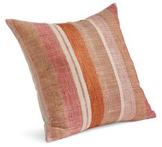 an orange and pink striped pillow on a white background