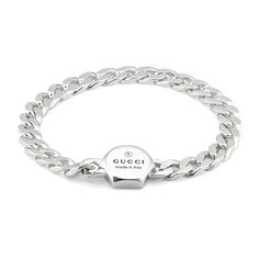 Crafted from 925 sterling silver, the Gucci trademark embossing defines this bracelet with a unique cassette closure. The intricate chain reflects the House's narrative, and further enhances the accessory. 925 sterling silver Gucci Trademark engraving Cassette closure Made in Italy Gucci Style #: YBA779173001018 Luxury Gucci Chain Bracelet For Gift, Sterling Silver Jewelry With Silver-tone Logo, Luxury Gucci Silver Chain Jewelry, Luxury Chain Bracelet With Sterling Silver Clasp As Gift, Luxury Silver Link Chain Bracelet, Luxury White Gold Bracelet With Silver Chain, Gucci Sterling Silver Jewelry With Polished Finish, Gucci Sterling Silver Classic Jewelry, Classic Gucci Sterling Silver Jewelry