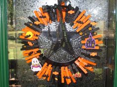 a clock made out of legos and halloween decorations