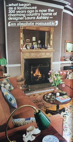 a living room filled with furniture and a fire place