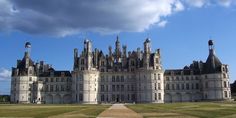 a large building with many windows and towers