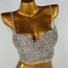 This Circle Rhinestone Chain Bra from Primadons and Donnas is a must-have for any fashionista. The bra is made with rhinestones and features a cut-out style crystal broach in the middle with adjustable chain drape sides. Silver is processed in 1 business day, while gold takes around 10 business days. This stunning piece is perfect for any special occasion or night out. With its unique design and quality craftsmanship, you'll be sure to turn heads. Get your Circle Rhinestone Chain Bra today and m Glamorous Bedazzled Jewelry For Party, Glamorous Bedazzled Party Jewelry, Party Rhinestone Crystal Necklace With Bling, Party Rhinestone Necklace With Bling, Party Rhinestone Bling Necklace, Party Crystal Rhinestone Necklace With Bling, Rhinestone Necklace For Parties, Crystal Rhinestone Necklace For Evening, Metal Rhinestone Party Necklace With Bling