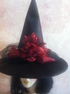 New this season! Scarlet or garnet red organza on this black satin hat with black tulle. Skull is optional. You can order the hat with or without. Just state your preference in the buyer notes! If no preference is stated it will not be added. Fits up to 22.75 inches head circumference. Halloween Costume Hat Accessories, Red Halloween Hat One Size Fits Most, Adjustable Red Mini Hat For Halloween, Fitted Red Halloween Hat, Red Mini Hats For Halloween Costume Party, Curved Brim Halloween Costume Hats And Headpieces, Curved Brim Costume Hats And Headpieces For Halloween Party, Halloween Wide Brim Fitted Mini Hat, Fitted Wide Brim Mini Hat For Halloween