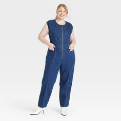 Add this Tailored Denim Jumpsuit from Universal Thread™ to your everyday wardrobe for putting together a variety of chic outfits. Made of recycled cotton, this denim jumpsuit is fashioned in a crewneck style with a zipper for easy on and off. This sleeveless jumpsuit boasts two front pockets and two back pockets to keep your essentials close at hand and also features belt hoops for versatile wear. Universal Thread™: Found exclusively at Target. Cargo Jumpsuit, Crewneck Style, Target Clothes, Hem Style, Sleeveless Jumpsuits, Denim Jumpsuit, Universal Thread, Everyday Wardrobe, Recycled Cotton