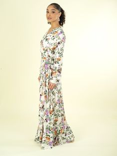 You'll instantly be in love! The Dalila floral print wrapped maxi dress fabric detail finish with high quality fabric. Ultra-chic dress with a surplice. Ruffle-trimmed high-low hem and has full closure. 59inch polyester hand-wash full lined Modest V-neck Floral Print Dress, Modest Fitted V-neck Maxi Dress, Spring Flowy Faux Wrap Maxi Dress, Flowy Faux Wrap Dress For Spring, Spring Flowy Wrap Maxi Dress, Spring Maxi Wrap Dress For Garden Party, Elegant Floral Print Maxi Wrap Dress, Flowy Wrap Maxi Dress For Spring, Spring Maxi Length Wrap Dress For Garden Party