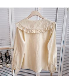 Beige Solid Color Blouse For Spring, Cute Cream Long Sleeve Blouse, Cute Long Sleeve Cream Blouse, Casual Long Sleeve Cream Blouse, Cream Long Sleeve Casual Blouse, Casual Cream Long Sleeve Blouse, Long Sleeve Apricot Tops For Fall, Long Sleeve Cream Cotton Blouse, Apricot Long Sleeve Blouse For Spring