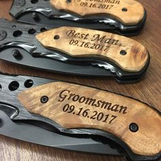 three personalized knifes are sitting on a wooden table with engraved names and date