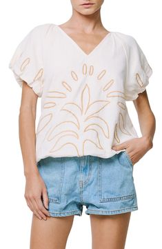 Abstract embroidery enlivens a blousony cotton top framed by puffy raglan sleeves. 21 1/2" length Back keyhole with button-and-loop closure V-neck Short sleeves 100% cotton Hand wash, dry flat Imported Asian & Pacific Islander Owned/Founded Spring Cotton Top With Raglan Sleeves, Relaxed Fit Embroidered Cotton Top For Fall, Relaxed Fit Cotton Embroidered Top For Fall, Casual Tops With Embroidered Short Sleeves, Spring Cotton Raglan Sleeve Tops, Casual Top With Embroidered Short Sleeves, Casual Cotton Tops With Blouson Sleeves, Floral Embroidered Puff Sleeve Tops For Fall, Floral Embroidery Puff Sleeve Tops For Fall