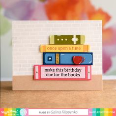 a birthday card with books stacked on top of each other and the words, once upon a time make this birthday one for the books