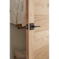 an open wooden door in a bedroom