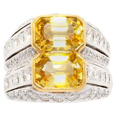 The diamond and yellow sapphire ring features 2 faceted emerald-cut yellow sapphires of brilliant crystalline color (5.01 carats total) flanked by 2.02 carats of custom-cut baguette diamonds. The design is complete with 1.40 carats of round diamonds set en pave. All our diamonds are of top quality (clarity, color and cut, F-VVS). The ring is one-of-a-kind. It was handmade in our own workshop in Italy with expert workmanship by maestro Franco Napolitano according to an original design by Ella Gaf Sapphire Ring Designs, Cocktail Ring Designs, Yellow Sapphire Ring, Canary Diamond, Sapphire Cocktail Ring, Gold Flower Ring, Yellow Sapphire Rings, Round Diamond Setting, Baguette Diamonds