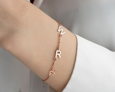 Welcome to Shimmer&Shine By Asya! 🌟 Elevate your style with our Custom Initial Bracelet, expertly crafted to reflect your unique identity. Customization Options: 1- Material Choices: Select from 925 Sterling Silver, 8K Solid Gold, 14K Solid Gold, or 14K Gold-Plated Silver. 2- Personalization: Choose the initials for your bracelet in the personalization menu. 3- Color Options: Available in classic silver (white), luxurious gold, and elegant rose gold. 4- Chain Length: Adjustable chain lengths fr Classic Adjustable Luxury Name Bracelet, Luxury Gold Sterling Silver Name Bracelet, Luxury Classic Name Bracelet With Initials, Luxury Adjustable Silver Name Bracelet, Luxury Classic Adjustable Name Bracelet, Dainty Personalized Luxury Name Bracelet, Dainty Luxury Personalized Name Bracelet, Luxury Personalized Dainty Name Bracelet, Luxury Initials Name Bracelet