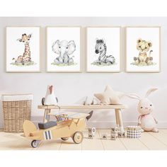 three children's wall art prints with animals and giraffes on them