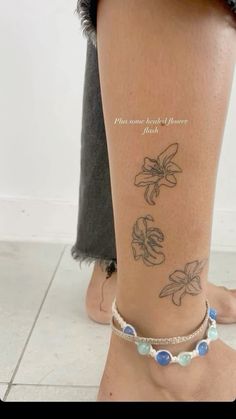 a woman's foot with tattoos on it and her ankle is shown in the foreground