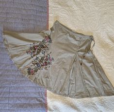 Gorgeous 90s Y2k boho hippy cargo panelled skirt in pale khaki with embroidered panel Size UK8 (low waist) may also fit size uk10 US 4 EU36 Side zip Tie trim to  Measurements Waist 30"  Length 23" Good preloved condition  100% cotton Made by Moto, Topshop All orders are shipped using biodegradable and recycled ♻️ packaging where possible Y2k Style Long Summer Skirt, Y2k Long Skirt For Summer, Y2k Long Summer Skirt, Cotton Y2k Skirt For Spring, Y2k Style Cotton Skirt For Spring, Y2k Style Tiered Skirt For Spring, Y2k Tiered Skirt For Spring, Spring Y2k Cotton Skirt, Spring Y2k Tiered Skirt