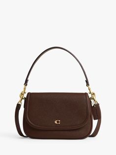 A smart shoulder bag perfect for work and weekends alike, choose this sleek piece from Coach. Crafted from leather with two detachable straps, it fastens with a secure flapover front with a signature Coach charm. Coach Tabby Wristlet, Coach Legacy Bag, Brown Coach Bag, Luxury Bags Collection, Handbag Essentials