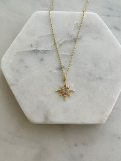 "✦DESCRIPTION ✦ Small motifs with big sparkle are our favorite when it comes to fine jewelry. Our Diamond Starburst Necklace is a delicate north star inspired piece with a diamonds. This necklace is available in 14k yellow gold, featuring a dainty chain and small star detail. -14K Solid Gold -Diamond 0.04 tcw -Pendant Length with the Bail 15 mm                  Width: 7 mm ✦Dear Customers  ✦   We strive to provide the best quality with affordable prices. We take such pride in making sure to create unique, beautiful jewelry for all our Sioro Silver customers, and always seek to provide the very best customer service to make sure we complete your jewelry needs. Thank you for visiting our shop and supporting our small business. you'd like to see more beautiful jewelry, click here to visit our Celestial Jewelry With Starburst Star Charm, Dazzling Star-shaped Sparkling Jewelry, Dazzling Sparkling Star Jewelry, Celestial Starburst Necklace With Star Charm, Dainty Sparkling Star-shaped Jewelry, Dainty Sparkling Star Jewelry, Sparkling Star-shaped Jewelry Gift, Gold Star-shaped Sparkling Jewelry, Gold Sparkling Star Jewelry