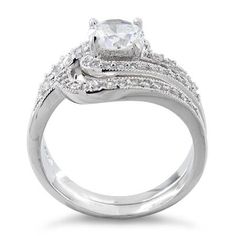 Top of ring height: 12.42mm

Band width: 6.5mm

Shank width: 4.4mm


Stone material: clear cubic zirconia

Center stone size: 6mm

Stone shape: round

Center stone carat weight: 0.8 ct.

Total number of CZ stones: 52

Stone setting: Prong setting


Metal: 925 sterling silver

Plating: rhodium plated

Finish: high polish Wedding Bypass Ring With Diamond Accents In Cubic Zirconia, Wedding Bypass Ring With Diamond Accents And Cubic Zirconia, Classic Cubic Zirconia Bypass Wedding Ring, Wedding Bypass Ring In Diamond White With Cubic Zirconia, Wedding Cubic Zirconia Bypass Ring In Diamond White, Diamond White Cubic Zirconia Bypass Ring For Wedding, Wedding Bypass Ring With Cubic Zirconia, Wedding Rings With Cubic Zirconia And Round Stone, Cubic Zirconia Diamond Ring For Wedding