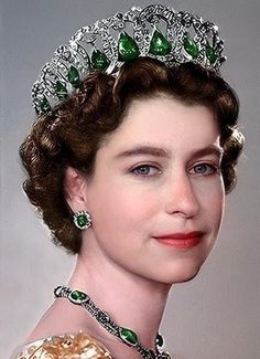 a woman wearing a tiara with emeralds and pearls on it's head