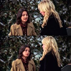 two women talking to each other in front of snow covered trees and bushes on the set of friends like me