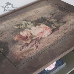 an old wooden box with flowers painted on it