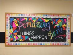 a chalkboard with the words amazing things happen written in multicolored letters on it