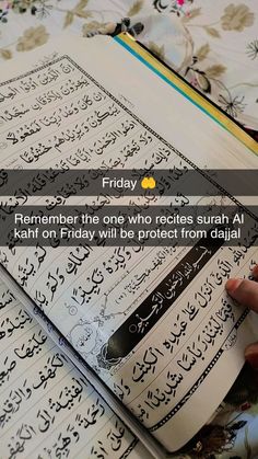 someone is writing on an open book with the text friday remember the one who recites surh al kaht or friday will be protect from