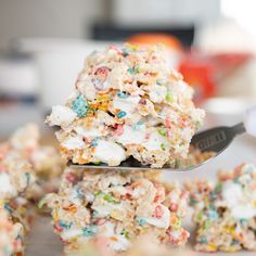 a spoon full of rice krispy treats on top of a plate with the title above it