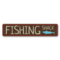 a sign that says fishing shack with a fish on it's back and the words,