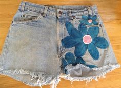 "These are new or vintage  made to order shorts.These shorts are distressed and have been pre-washed. I decorated them with vibrant blue and pink flowers on both sides. I used permanent textile paint. I hope you love them. These come in every size,or send me your favorite shorts to paint. Then, these are rust suede tie dye long shorts and high waisted. The waist is 28\" and the length isb24\". They are lined . These were made from designer suede pants.  They are 99$. Send me a conversation if you want them. S hipping is two day priority in the U.S. And first class everywhere else. Thankyou for visiting my shop. Please come back again. Send me a conversation as to what exactly you want. You can customize these in different colors." Vintage Shorts With Built-in Shorts For Spring, Retro Floral Print Shorts, Spring Retro Cutoff Shorts, Vintage Style Jean Shorts For Spring, Vintage Jean Shorts For Spring, Retro Cutoff Shorts For Spring, Vintage High-waisted Jean Shorts For Spring, Vintage Short Bottoms For Spring, Vintage Relaxed Fit Jean Shorts For Spring